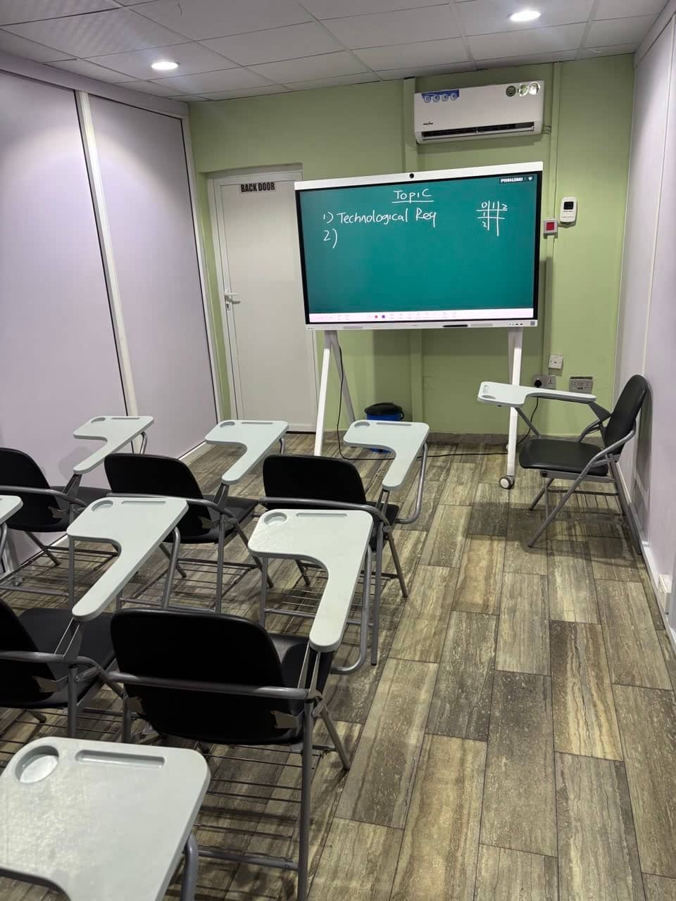 A small classroom with an interactive screen